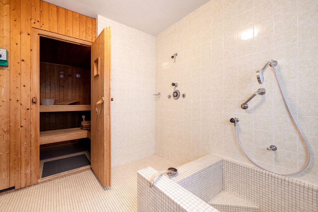 Wellness area with sauna and rain shower